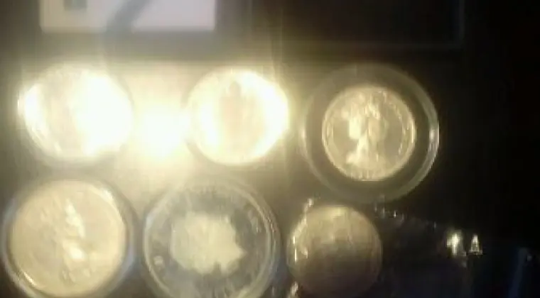 Zestaw srebrnych monet po numizmatyku